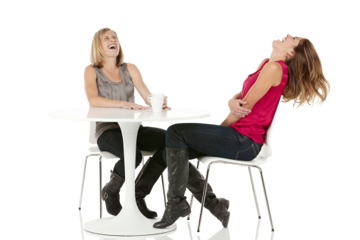 Female friends having coffee and laughinghttp://www.twodozendesign.info/i/1.png