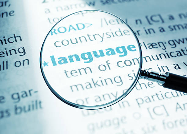 Language "Definition of the word - language, close-up shot from a dictionary." translation photos stock pictures, royalty-free photos & images