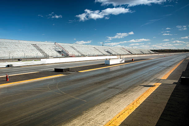 Empty drag racing strip Sport driving race start line with tire tracks drag racing stock pictures, royalty-free photos & images