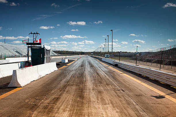 Empty drag racing strip Sport driving race start line with tire tracks drag racing stock pictures, royalty-free photos & images