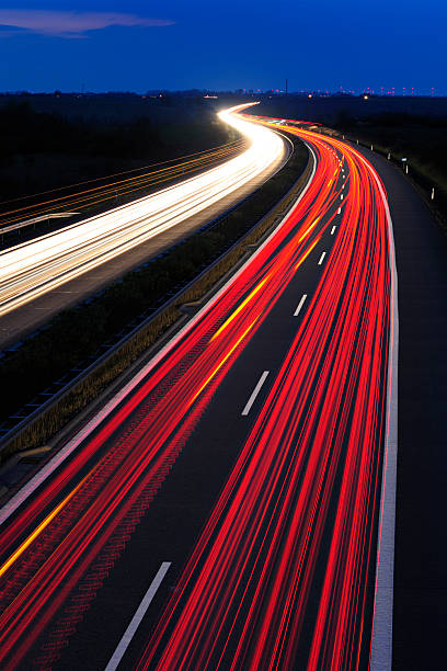 istock Blurred Motion of Car Lights on Highway at Night 175416899