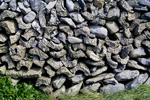 Detail of a stacked-stone fence/wall around the border of The Burren in County Clare, Ireland.