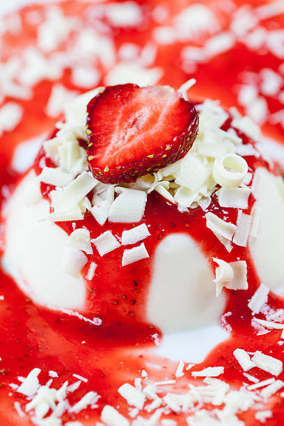 Panna cotta with strawberries and white chocolate stock photo
