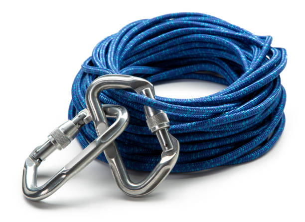 Close-up of vibrant blue tow strap tightly coiled, featuring durable silver metal hook. Heavy-duty strap provides reliable strength for towing vehicles, securing loads, or recovery operations. Clean white background emphasizes detail of textured webbing material.