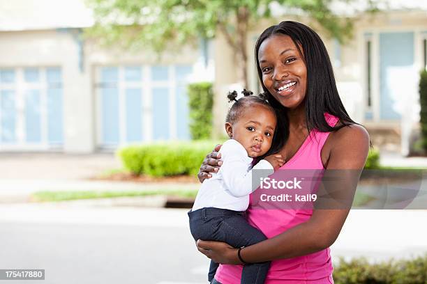 African American Mother Holding Baby In Front Yard Stock Photo - Download Image Now - Baby - Human Age, Mother, African-American Ethnicity