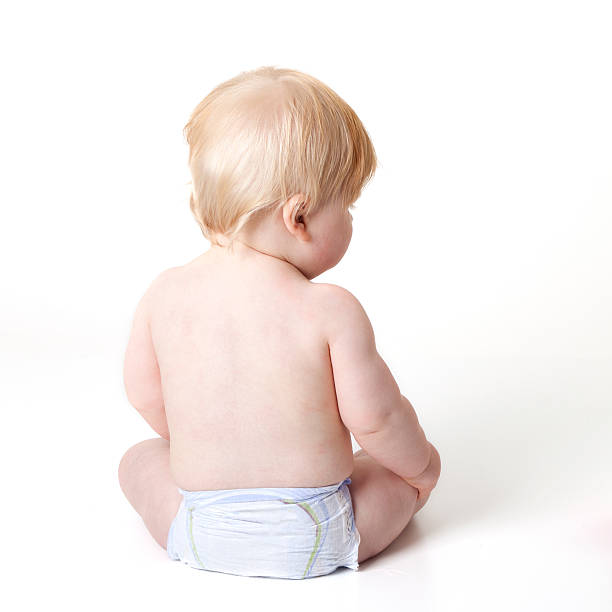 istock baby in diaper sitting with his back towards the camera 175417881