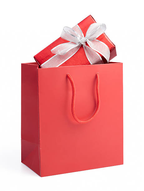 istock Red gift box with white bow ribbon in a red gift bag 175418328