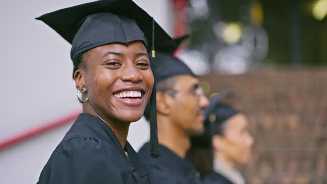Graduation, student or face of happy black woman for ceremony, college progress or class graduate event. School campus, learning development portrait and group line, row and waiting for academy award