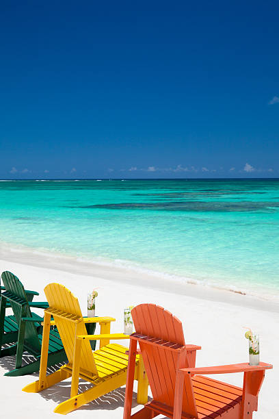 istock colorful chairs with drinks at a tropical Caribbean beach 175418949