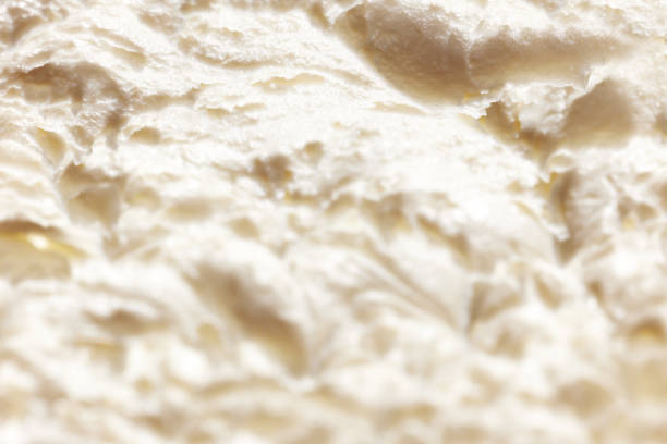 istock Close-up image of melted ice-cream. Vanilla natural ice cream texture 1754191084