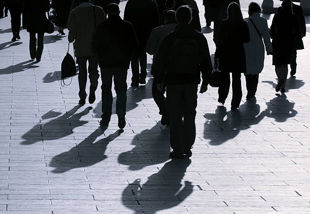 istock Morning sun casting shadows of people going to work 175419358