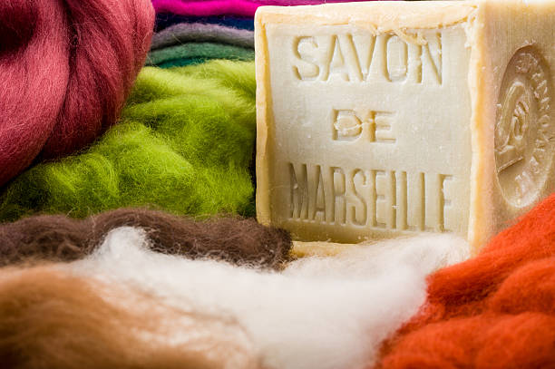 Colorful wool and bar of French soap used for felting  stock photo
