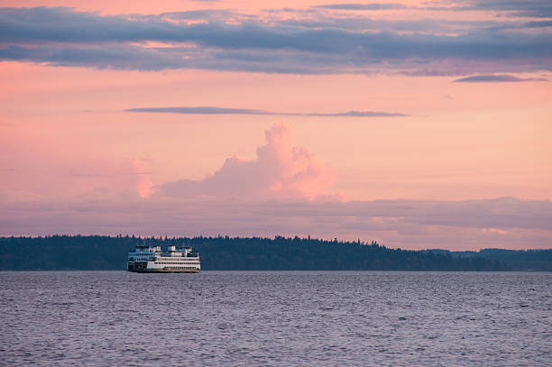 A Ferry headed to Bainbridge Island at Sunset across Elliot Bay.