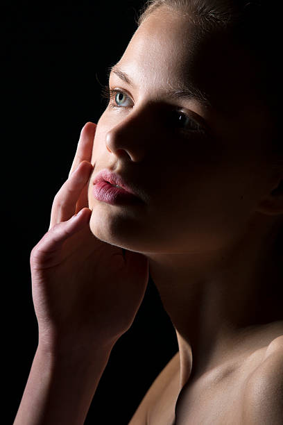 istock Young Woman face in low key 175419825