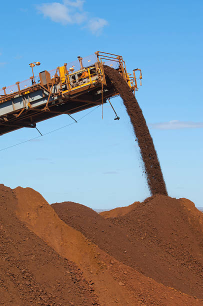 istock Iron ore being loaded onto a stockpile. 175419931