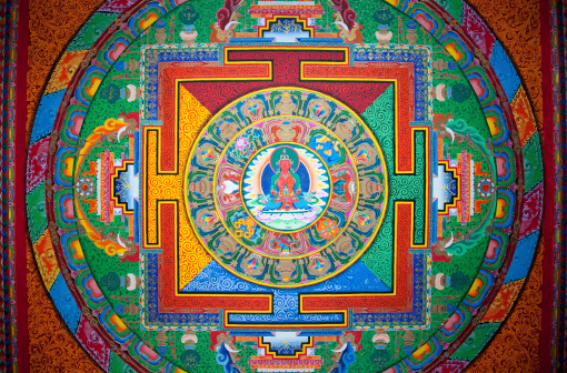 A wall painting, representing a mandala, at the Shangri-La Songzanlin Monastery (or Ganden Sumtseling temple) in the Yunnan Provice in China.  Mandalas, concentric diagrams, have spiritual and ritual significance in both Buddhism and Hinduism. Religious Paintings and statues are in the public domain. Buddhist art is anonymous, religious and as a result it has no aesthetic function by itself.  Paintings are not signed, paintings have no copyright. This is all well explained in Françoise Pommaret’s “Bhutan, Himalayan Mountain Kingdom” edited by Odyssey Books & guides.