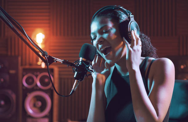 istock Woman recording an audio track in the studio 1754201056