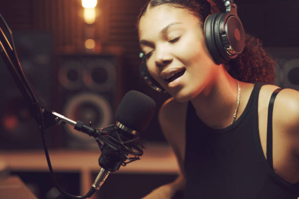 istock Woman recording an audio track in the studio 1754202305
