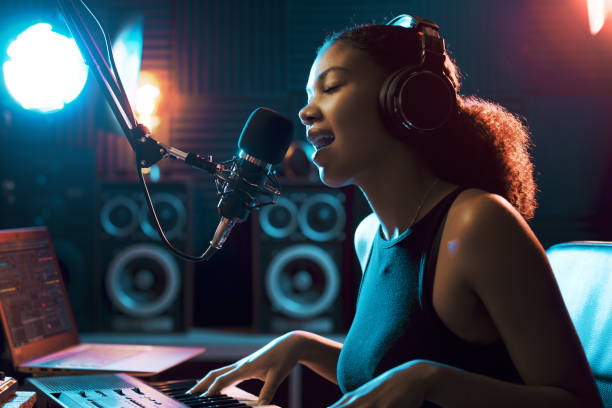 istock Woman singing and playing in the recording studio 1754203020