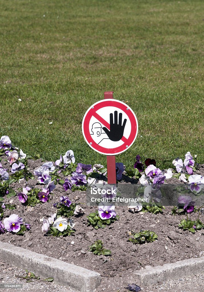 No passage "a sign in the flower bed which means stop, no passage" Concepts Stock Photo