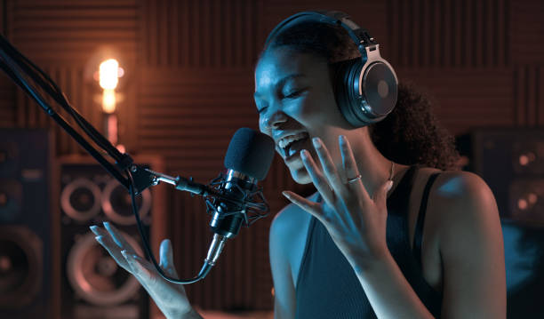 istock Woman recording an audio track in the studio 1754204844
