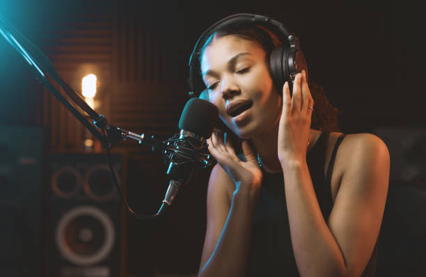istock Woman recording an audio track in the studio 1754207217