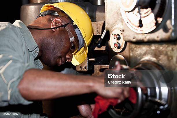 African American Worker Using Drill Press Stock Photo - Download Image Now - Machinery, Repairing, Manufacturing