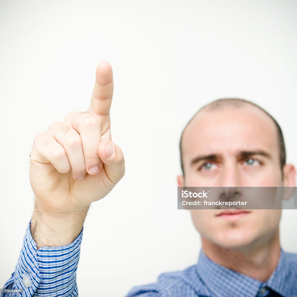 Caucasian business man aiming with finger 25-29 Years Stock Photo