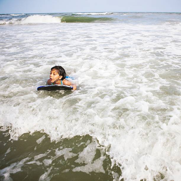 istock little girl surfer 175420977