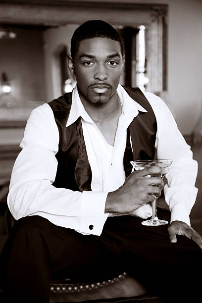 istock Handsome african american man in tuxedo vest with martini 175421137
