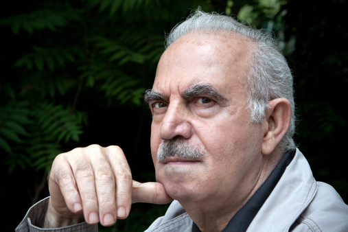 Elderly Turkish man hand on chine,black background