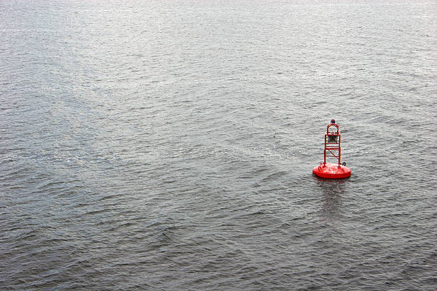 bóia na água - buoy anchored sea wave - fotografias e filmes do acervo