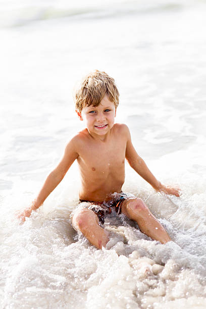 istock Little Boy in the Ocean at Beach 175422358