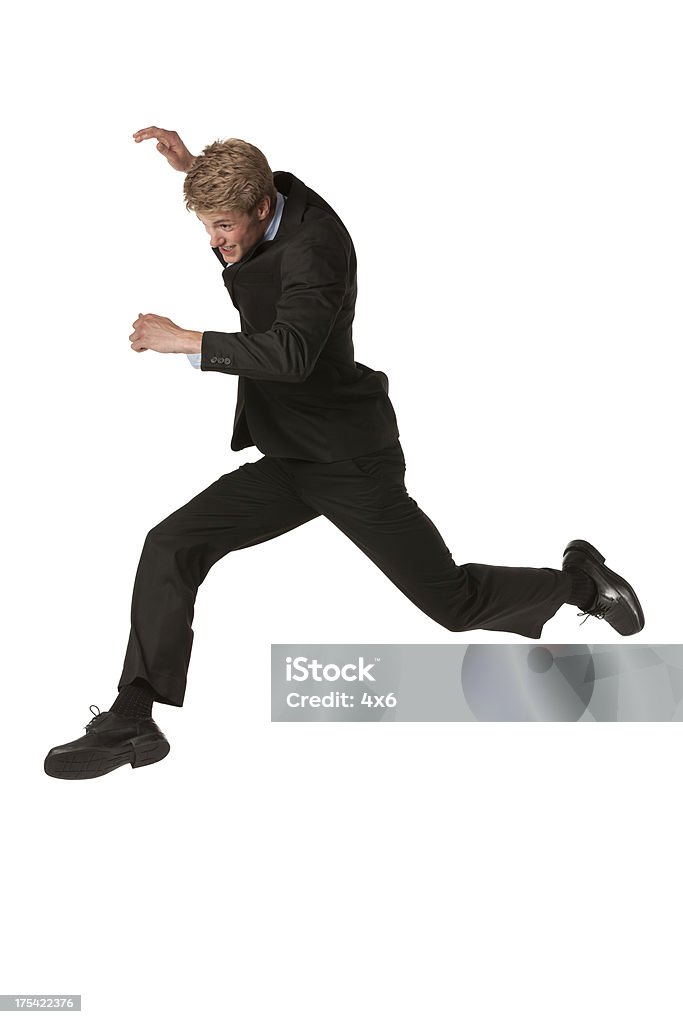 Businessman in rush Jumping Stock Photo