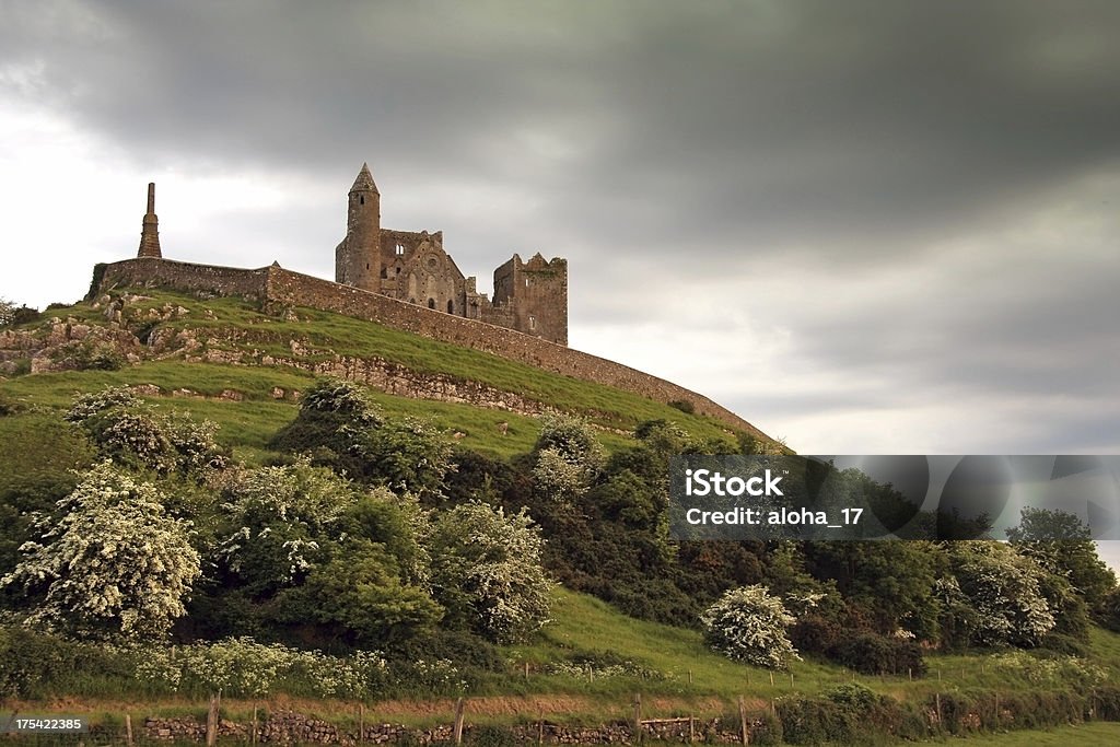 Rock of Cashel (Ireland) Rock of Cashel in Ireland in the evening with dramatic thunderstorm sky. It has an eerie atmosphere.For more images from Ireland click below: Cashel Stock Photo
