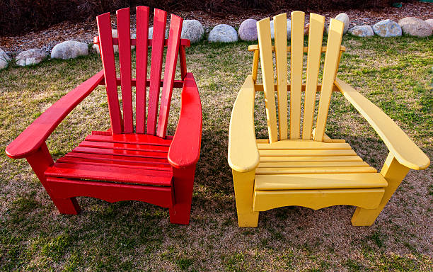 istock Colorful Red and Yellow Adirondack Chairs on Lawn 175422582