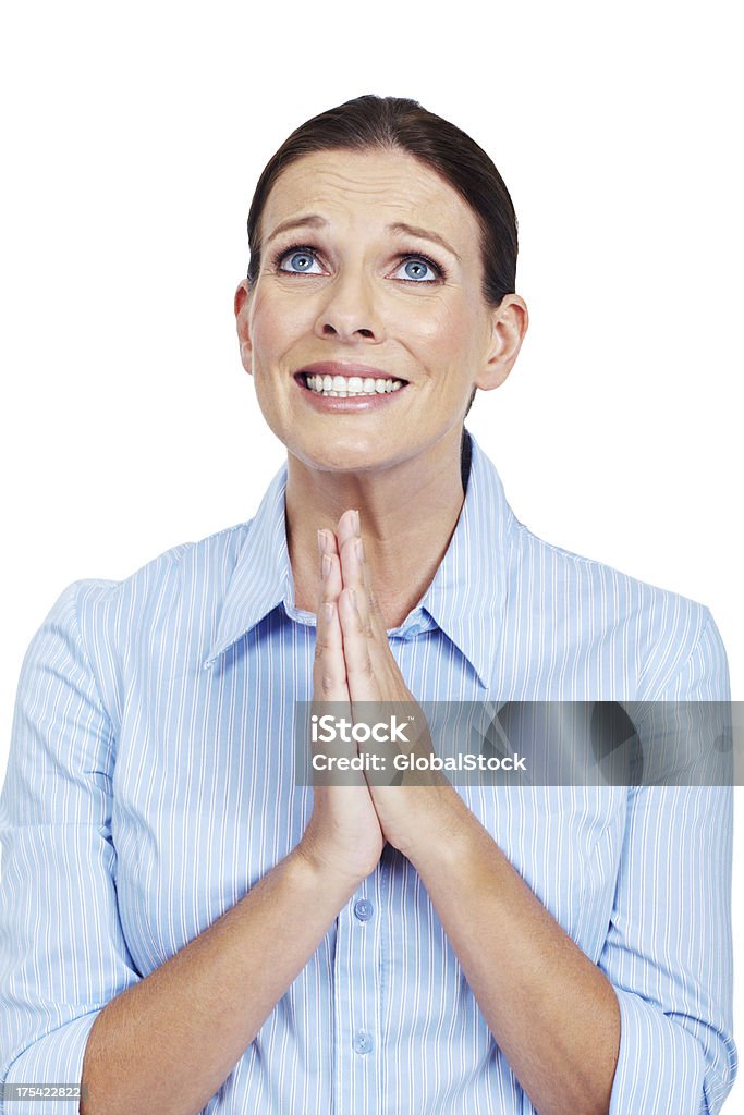 Pretty please Mature woman praying on a white background 30-39 Years Stock Photo