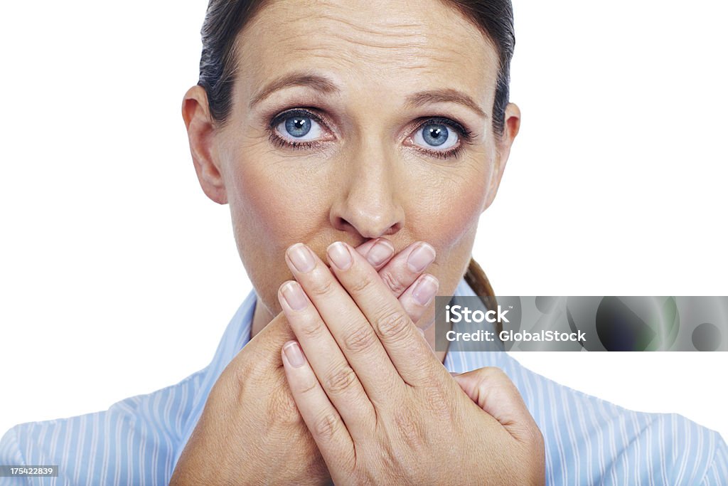 Not feeling too good Closeup portrait of a mature woman covering her mouth with her hands - isolated on white 30-39 Years Stock Photo