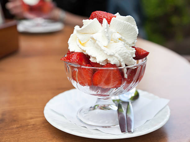 istock coupe glass strawberries and cream 175422922