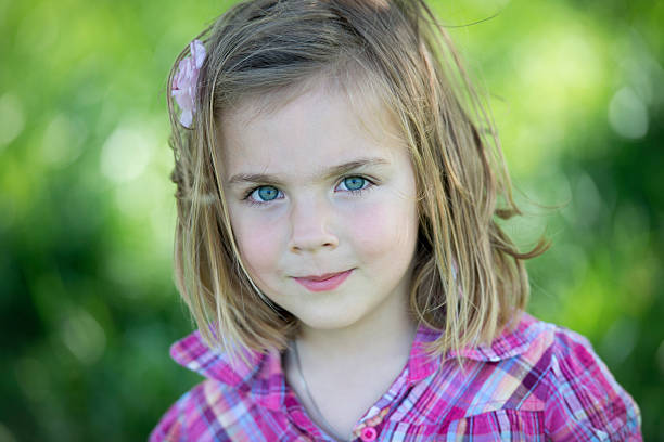 istock smiling little girl looking at camera 175423159