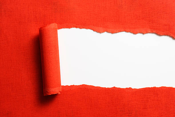 Isolated shot of torn red paper on white background