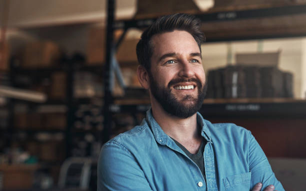 istock Happy, thinking and young man designer in a studio with positive, good and confident attitude for small business. Happiness, smile and male person from Canada with entrepreneurship mindset in office. 1754233882