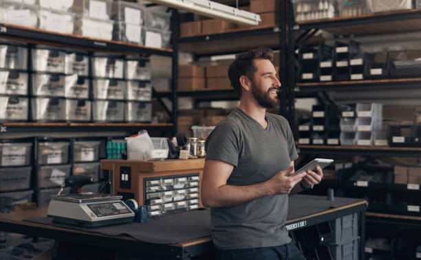 istock Tablet, thinking and a man in a maintenance workshop for production, manufacturing or repairs. Technology, industry and tools for service with a young engineer, designer or technician for ecommerce 1754235046