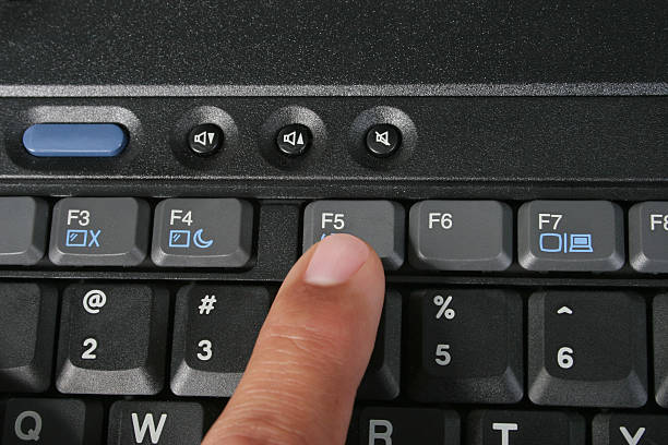 F5 Computer Key Computer Keyboard with finger on F5 Computer Key. The F5 key is the refresh key. refresh button on keyboard stock pictures, royalty-free photos & images