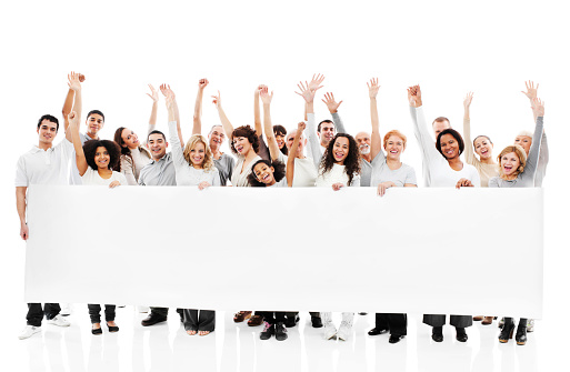 Large group of a cheerful people with raised hands are holding a big paper for commercials. They are isolated on white background.