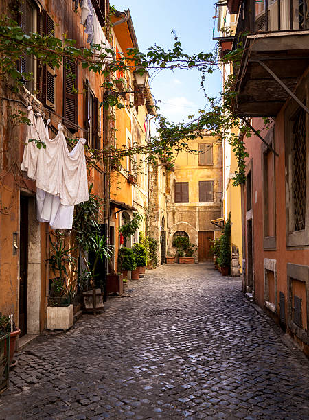 Italian old town (Trastevere in Rome) Narrow street in Trastevere district in Rome, Italy. rome italy photos stock pictures, royalty-free photos & images