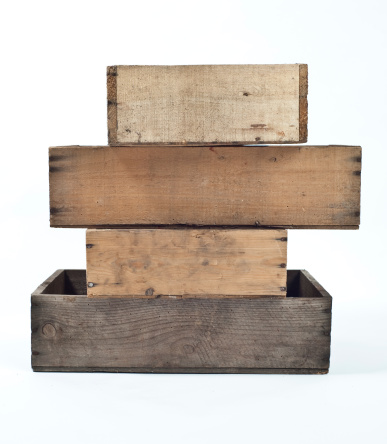 a stack of old wooden crates