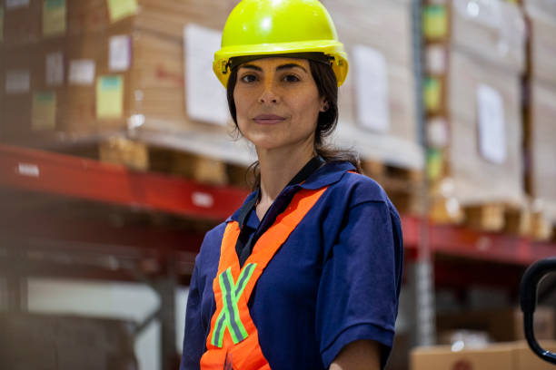istock Female warehouse packer standing in storage facility 1754239335