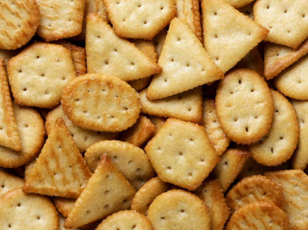 istock Crackers cookies of different shapes background. View top 1754241152