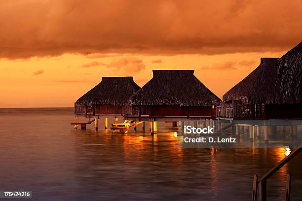 Water Houses In The Tahiti Sunset Stock Photo - Download Image Now - Tahiti, Hotel, Beach
